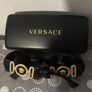 Versace glasses with metal studs around the frame
